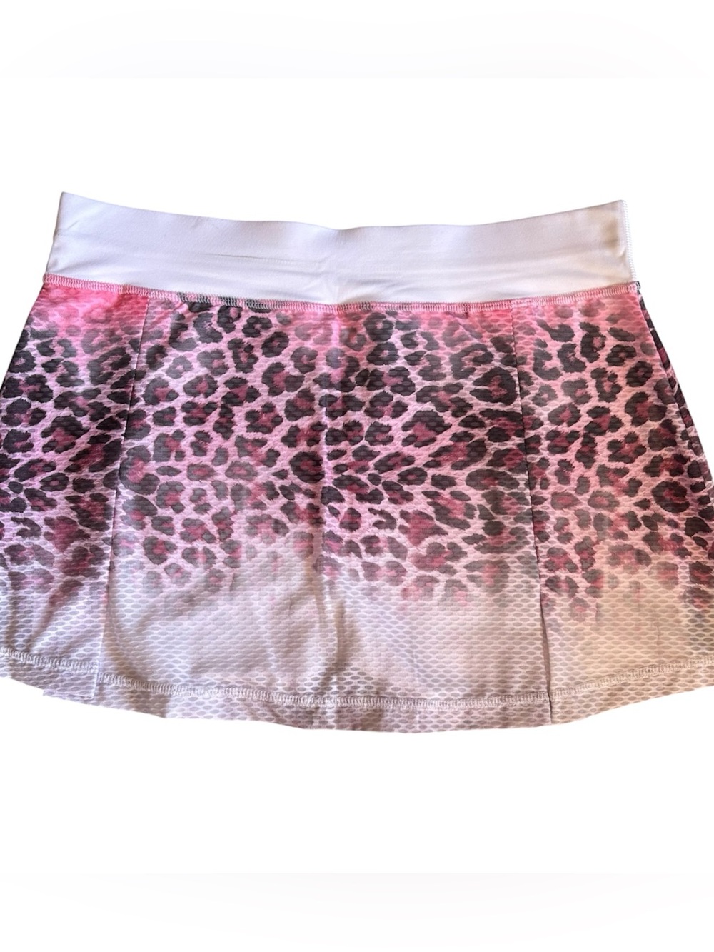 Women's Sofibella skort in pink and gray leopard design for active sports.